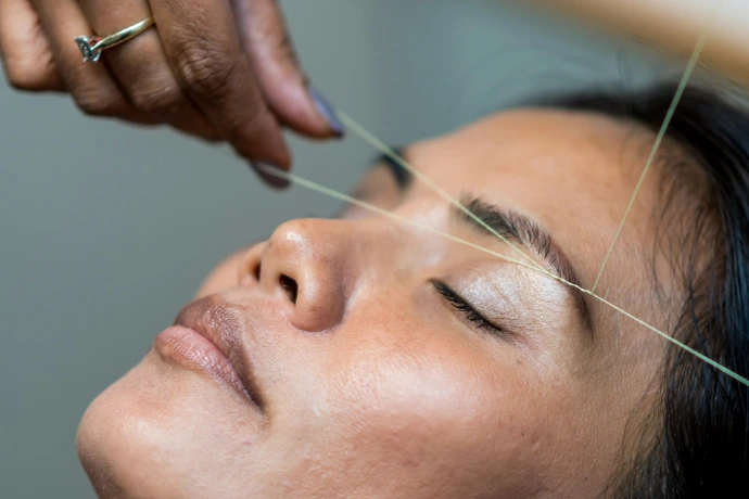 closeup photography of woman's face Organic Beauty Salon